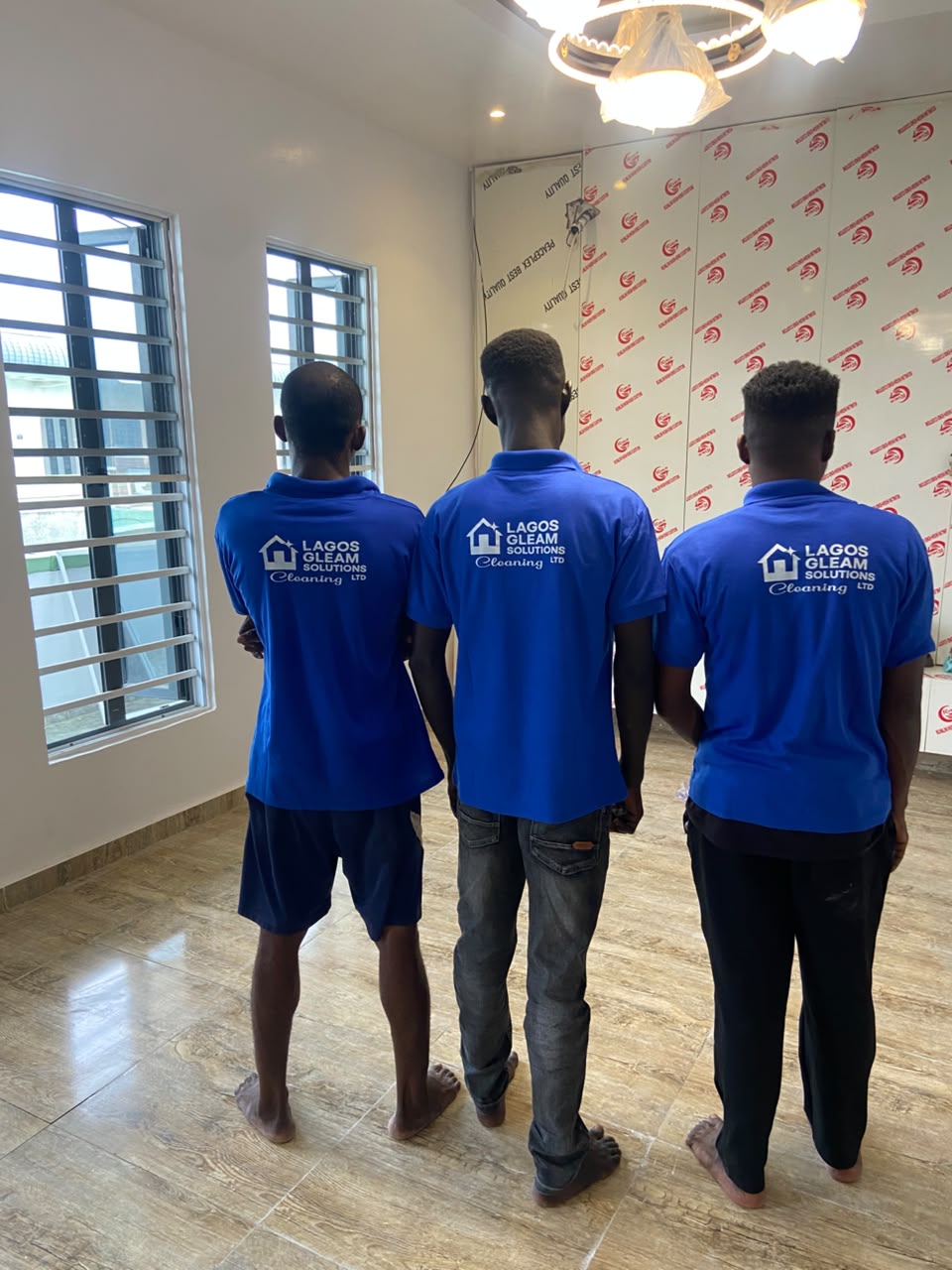 Lagos Gleam cleaners in branded blue uniforms on a Lagos job