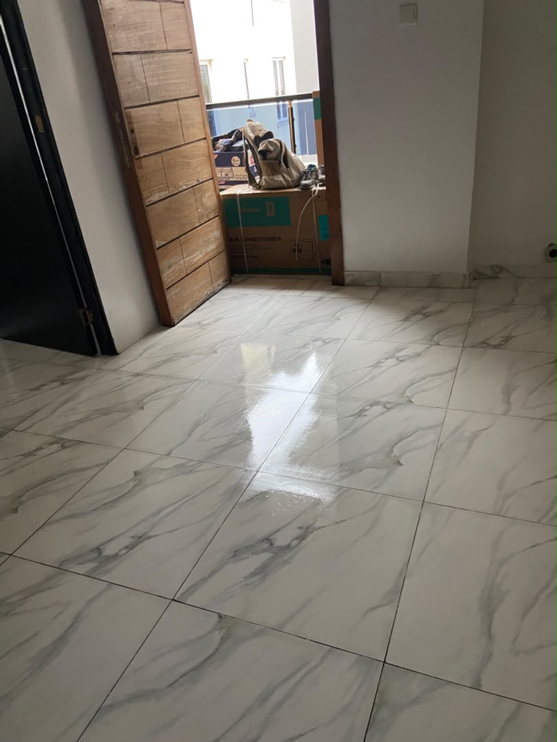 The same marble floor cleaned and polished to a shine after post-construction cleaning