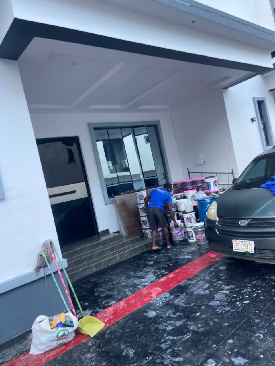 Lagos Gleam technician with cleaning and fumigation supplies at a Lagos property